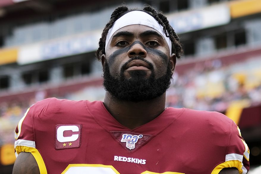 Washington Redskins strong safety Landon Collins stands on the sideline prior to an NFL football game against the New England Patriots, Sunday, Oct. 6, 2019, in Landover, Md. (AP Photo/Mark Tenally)