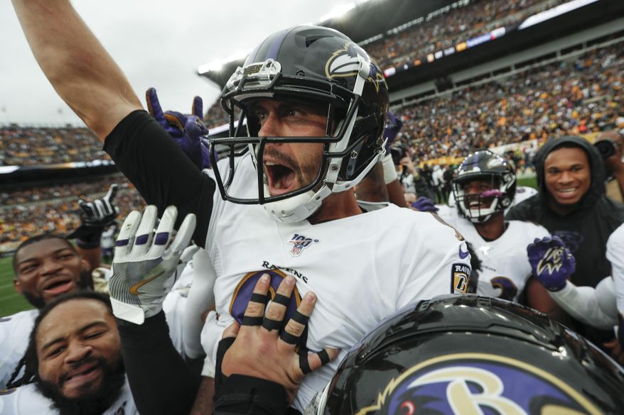 Baltimore Ravens kicker Justin Tucker (9) and Sam Koch (4) celebrates with teammates after he made a field goal to defeat the Pittsburgh Steelers in overtime of an NFL football game, Sunday, Oct. 6, 2019, in Pittsburgh. The Ravens won 26-23. (AP Photo/Don Wright)