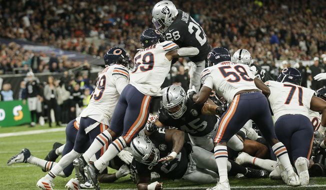Oakland Raiders running back Josh Jacobs (28) goes in for a touchdown during the second half of an NFL football game against the Chicago Bears at Tottenham Hotspur Stadium, Sunday, Oct. 6, 2019, in London. (AP Photo/Tim Ireland)