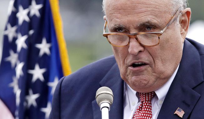FILE - This Aug. 1, 2018, file photo shows Rudy Giuliani, an attorney for President Donald Trump, in Portsmouth, N.H. As Giuliani was pushing Ukrainian officials in the spring of 2019 to investigate one of Donald Trump’s main political rivals, a group of individuals with ties to the president and his personal lawyer were also active in the former Soviet Republic. (AP Photo/Charles Krupa, File)