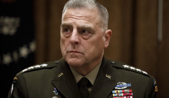 Chairman of the Joint Chiefs of Staff Gen. Mark Milley, participates in a briefing with President Donald Trump and senior military leaders in the Cabinet Room at the White House in Washington, Monday, Oct. 7, 2019. (AP Photo/Carolyn Kaster)