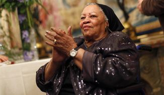 FILE - In this Sept. 21, 2012, file photo, U.S. novelist Toni Morrison applauds as she attends the America Festival at the U.S. embassy, in Paris. A book of Toni Morrison quotations is coming out in December 2019. “The Measure of Our Lives: A Gathering of Wisdom” will draw from her whole body of work, including such celebrated novels as “Beloved” and “Song of Solomon.” The foreword is by Zadie Smith, adapted from a tribute she wrote soon after the Nobel laureate died in August 2019 at age 88. (AP Photo/Thibault Camus, File)