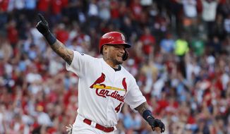 St. Louis Cardinals&#39; Yadier Molina reacts after hitting an RBI-single during the eighth inning in Game 4 of a baseball National League Division Series against the Atlanta Braves, Monday, Oct. 7, 2019, in St. Louis. (AP Photo/Jeff Roberson)