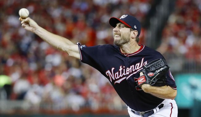 Washington Nationals starting pitcher Max Scherzer throws against the Los Angeles Dodgers during the fourth inning in Game 4 of a baseball National League Division Series, Monday, Oct. 7, 2019, in Washington. (AP Photo/Alex Brandon)