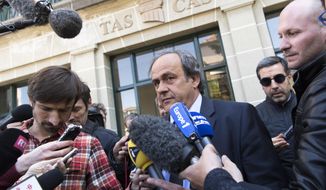 FILE - In this Friday, April 29, 2016 file photo, UEFA President Michel Platini leaves the international Court of Arbitration for Sport, CAS, after a hearing in Lausanne, Switzerland. Michel Platini is free to work in soccer again on Tuesday, Oct. 8, 2019 morning after his four-year ban by FIFA expires overnight. The former UEFA president told The Associated Press on Monday unsure he is where and when he will return. (Laurent Gillieron/Keystone via AP, file)
