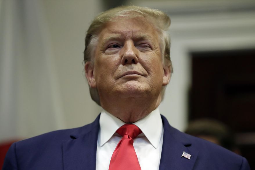 President Donald Trump winks as he listens before a trade agreement signing with Japan in the Roosevelt Room of the White House, Monday, Oct. 7, 2019, in Washington. (AP Photo/Evan Vucci)