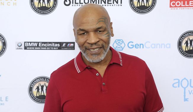 FILE - In this Aug. 2, 2019, file photo, Mike Tyson attends a celebrity golf tournament in Dana Point, Calif. Former heavyweight champion Mike Tyson is set to join the Professional Fighters League and host the new series “Mike Tyson’s New Fight Game: The PFL.&amp;quot; Tyson will conduct interviews with fighters, and musicians, entertainers and other famous fans of mixed martial arts. (Photo by Willy Sanjuan/Invision/AP, File)