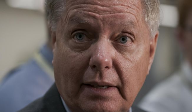 Senate Judiciary Committee Chairman Lindsey Graham, R-S.C., takes questions from reporters following a closed-door briefing on Iran, at the Capitol in Washington, Wednesday, Sept. 25, 2019. (AP Photo/J. Scott Applewhite)