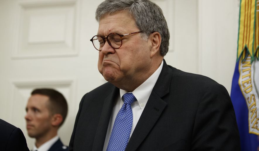 Attorney General William Barr declines an offer from President Donald Trump to speak during a ceremony to present the Presidential Medal of Freedom to former Attorney General Edwin Meese, in the Oval Office of the White House, Tuesday, Oct. 8, 2019, in Washington. (AP Photo/Alex Brandon)