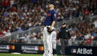 Minnesota Twins starting pitcher Jake Odorizzi watches a home run hit by New York Yankees&#39; Gleyber Torres during the second inning in Game 3 of a baseball American League Division Series, Monday, Oct. 7, 2019, in Minneapolis. (AP Photo/Bruce Kluckhohn)