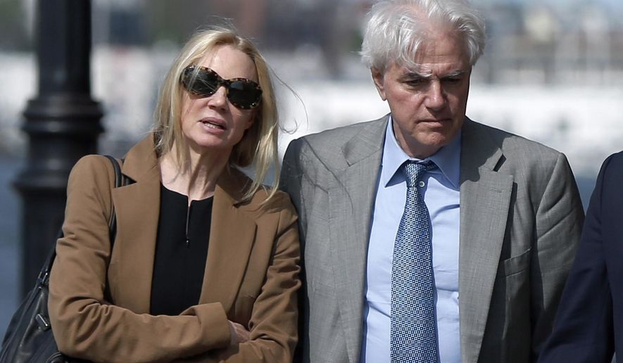 FILE - In this May 22, 2019 file photo, Marcia, left, and Gregory Abbott leave federal court after they pleaded guilty to charges in a nationwide college admissions bribery scandal. They are scheduled to be sentenced on Tuesday, Oct. 8. (AP Photo/Michael Dwyer, File)