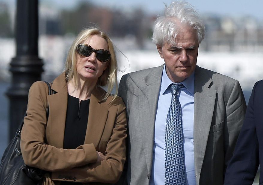 FILE - In this May 22, 2019 file photo, Marcia, left, and Gregory Abbott leave federal court after they pleaded guilty to charges in a nationwide college admissions bribery scandal. They are scheduled to be sentenced on Tuesday, Oct. 8. (AP Photo/Michael Dwyer, File)