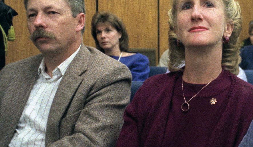FILE - In this Sept, 27, 1999, file photo, Carolyn Sullivan, widow of slain University of Nevada, Reno Police Sgt. George Sullivan, reacts as the guilty verdict is read against her husband's killer, Siaosi Vanisi, in Reno, Nev. With her is family friend Kelly Dean. The American Bar Association has joined an appeal challenging the death sentence of Vanisi, it says was mentally ill when he was convicted of the 1998 hatchet slaying of Sullivan. The national group of lawyers and professional legal scholars is asking the Nevada Supreme Court to block Vanisi's execution. (Marilyn Newton/The Reno Gazette-Journal via AP, Pool, File)