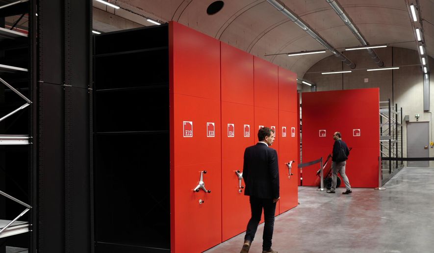 Reinforced storage lockers are pictured at the Louvre Conservation Center, which was inaugurated in Lievin in northern France, Tuesday Oct.8, 2019. Protecting the museum's works from the nearby Seine River has taken on additional urgency in recent years, as severe floods in 2016 and 2018 forced the Louvre to evacuate artworks and close exhibits. Officials hope to store some 250,000 artworks at the new center in five years' time. (AP Photo/Michel Spingler)