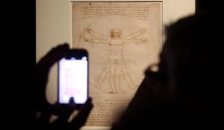 This Tuesday April 14, 2015 photo made available Tuesday Oct. 8, 2019 shows Leonardo da Vinci&#39;s &amp;quot;Vitruvian Man&amp;quot; during an exhibition in Milan, Italy. An administrative court in Venice has temporarily suspended Tuesday Oct. 8, 2019  the loan of Leonardo da Vinci&#39;s &amp;quot;Vitruvian Man&amp;quot; to the Louvre for an exhibition that is set to open later this month. (Matteo Bazzi/ANSA via AP)