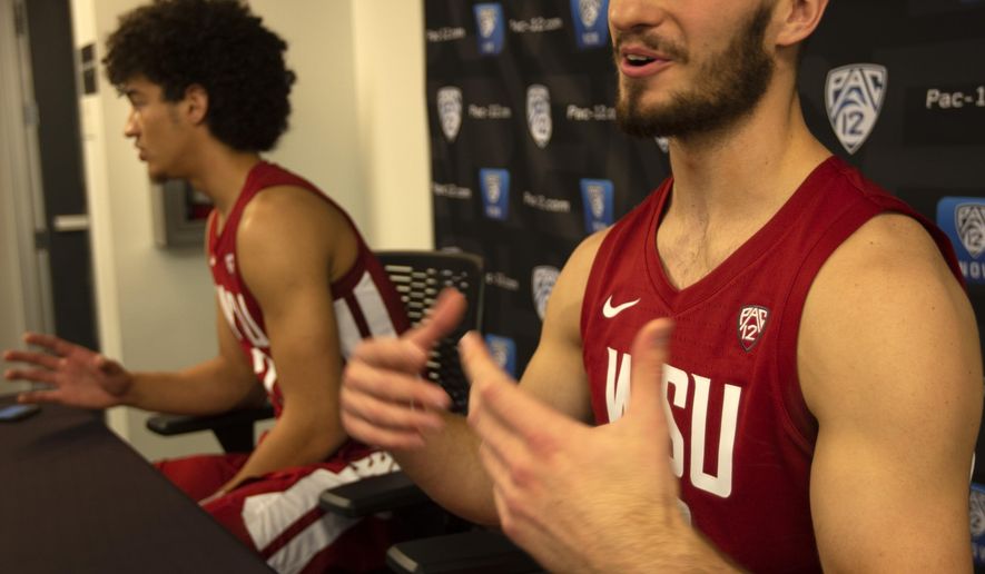 Washington State's CJ Elleby, left, and Jeff Pollard speak during the Pac-12 NCAA college basketball media day Tuesday, Oct. 8, 2019 in San Francisco. (AP Photo/D. Ross Cameron)