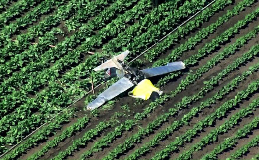 This photo from video provided by KTLA-TV shows the wreckage of a small plane where it crashed and caught fire, killing the pilot, the sole occupant, in a field near Camarillo Airport in Camarillo, Calif., Tuesday, Oct. 8, 2019. Ventura County Fire Department Capt. Brian McGrath says firefighters found the aircraft engulfed in flames and quickly extinguished the blaze. The Federal Aviation Administration and National Transportation Safety Board will investigate. (KTLA-TV via AP)