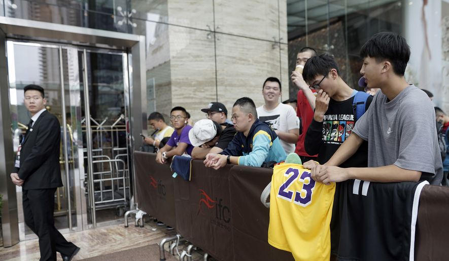 Chinese basketball fans gather outside of a hotel for a press conference that was later postponed ahead of an NBA preseason basketball game on Thursday between the Los Angeles Lakers and Brooklyn Nets in Shanghai, China, Wednesday, Oct. 9, 2019. The NBA has postponed Wednesday&#x27;s scheduled media sessions in Shanghai for the Brooklyn Nets and Los Angeles Lakers, and it remains unclear if the teams will play in China this week as scheduled. (AP Photo)