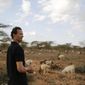 Gerald Erebon looks over livestock at the Archers Post settlement in Kenya on Sunday, June 30, 2019. Erebon has been an outcast all his life: Tall, light-skinned with wavy hair, he looks nothing like the dark-skinned Kenyan man listed as his father on his birth certificate, or his black mother or siblings. He and his family say that’s because his biological father is the Rev. Mario Lacchin, an Italian priest of the Consolata Missionaries order who ministered in Archers Post, Kenya in the 1980s. (AP Photo/Brian Inganga)