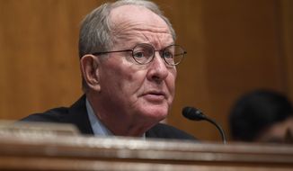 FILE - In this Sept. 24, 2019, file photo, Sen. Lamar Alexander, R-Tenn., speaks on Capitol Hill in Washington. Alexander says in a written statement that impeaching Trump would be a “mistake.” He says next year’s election is “the right way to decide who should be president.” He says it was “inappropriate” for Trump to push another country to investigate a political opponent. (AP Photo/Susan Walsh, File)