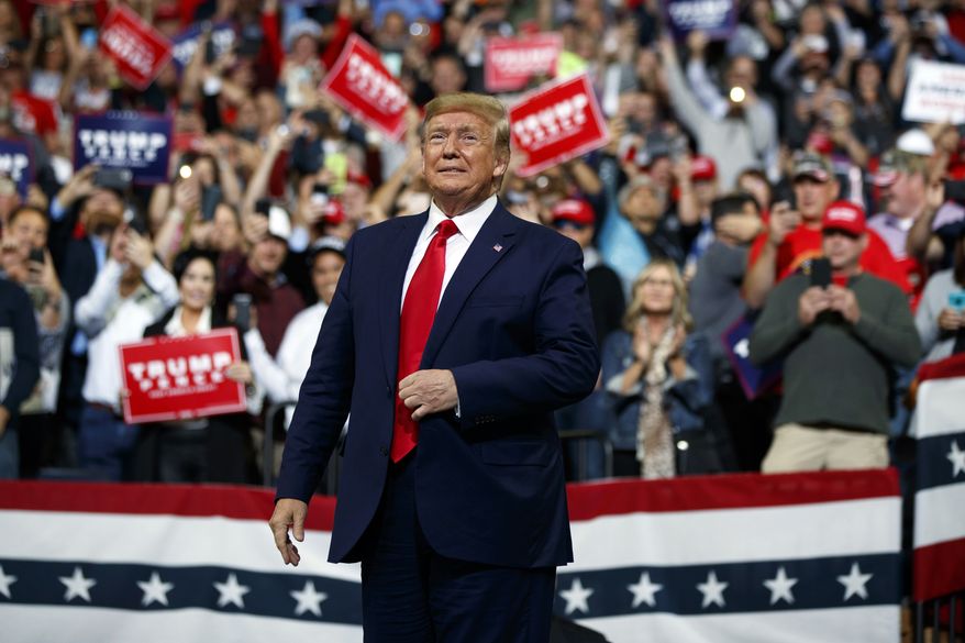 President Donald Trump arrives to speak at a campaign rally at the Target Center, Thursday, Oct. 10, 2019, in Minneapolis. (AP Photo/Evan Vucci)
