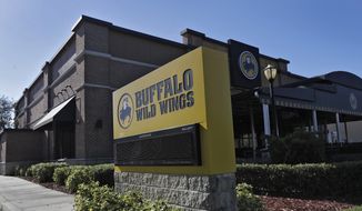 A Buffalo Wild Wings restaurant is shown Tuesday, Nov. 28, 2017, in Valrico, Fla. Fast food chain Arby&#x27;s is buying Buffalo Wild Wings. The deal is expected to close in 2018&#x27;s first quarter. It still needs the approval of Buffalo Wild Wings shareholders. (AP Photo/Chris O&#x27;Meara)