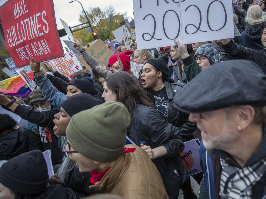 Protestors gather outside the Target Center before President Donald Trump's visit, Thursday, Oct. 10, 2019 in Minneapolis. Anti-Trump protesters are converging on the Minneapolis arena where President Donald Trump is holding his first political rally since the House opened its impeachment inquiry.(Elizabeth Flores/Star Tribune via AP)