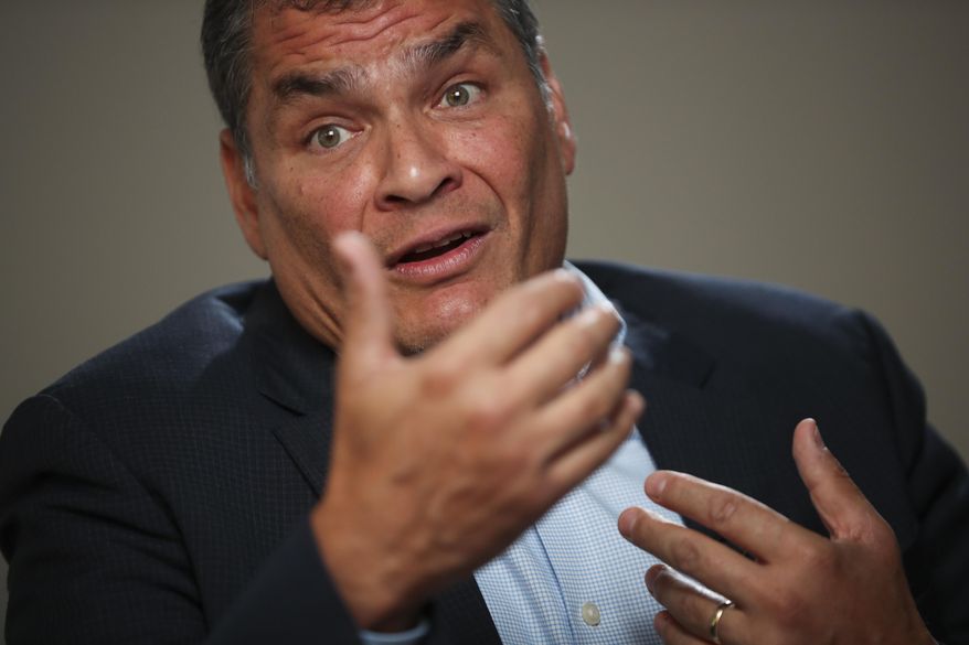 Former Ecuador President Rafael Correa answered questions during an interview with Associated Press in Brussels, Thursday, Oct. 10, 2019. Correa is dismissing as "nonsense" allegations that he is plotting with Venezuela President Nicolas Maduro to destabilize the current Ecuador government amid violent unrest sparked by fuel price hikes. (AP Photo/Francisco Seco)
