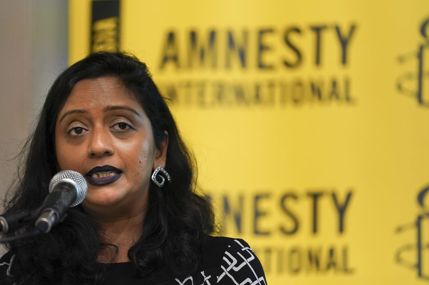 Shamini Darshni Kalimuthu, Executive Director of Amnesty International Malaysia, seeks during a press conference in Petaling Jaya, Malaysia, Thursday, Oct. 10, 2019. Amnesty International has urged Malaysia to abolish the death penalty, saying unfair trials and the use of harsh treatment to obtain confessions put people at risk of execution. (AP Photo/Vincent Thian)