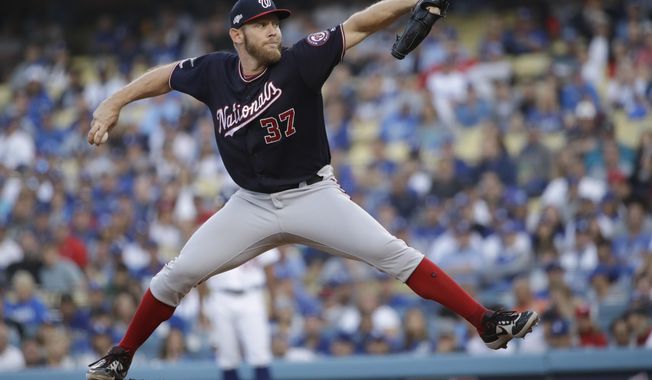 Washington Nationals starting pitcher Stephen Strasburg throws to a Los Angeles Dodgers batter during the first inning in Game 5 of a baseball National League Division Series on Wednesday, Oct. 9, 2019, in Los Angeles. (AP Photo/Marcio Jose Sanchez)