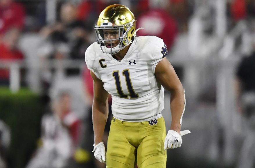 FILE - In this Sept. 21, 2019, file photo, Notre Dame safety Alohi Gilman works against Georgia during the second half of an NCAA college football game in Athens, Ga. Gilman thought he’d be on the other side of the Notre Dame-Southern California rivalry when he decided to transfer from Navy three years ago. (AP Photo/Mike Stewart, File)