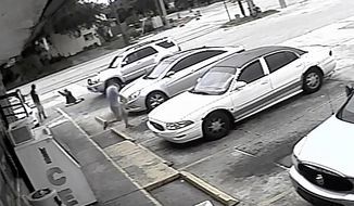 FILE - In this Thursday, July 19, 2018 file image taken from surveillance video released by the Pinellas County Sheriff&#39;s Office, Markeis McGlockton, far left, is shot by Michael Drejka during an altercation in the parking lot of a convenience store in Clearwater, Fla. Drejka, of Florida, who told detectives that he was irritated by people who illegally park in handicapped spots will be sentenced Thursday, Oct. 10, 2019, in the fatal shooting of McGlockton, an unarmed black man outside a convenience store. A jury found him guilty of manslaughter in August. (Pinellas County Sheriff&#39;s Office via AP, File)
