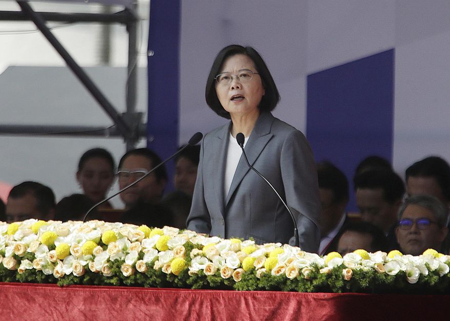 Taiwan President Tsai Ing-wen delivers a speech during National Day celebrations in front of the Presidential Building in Taipei, Taiwan, Thursday, Oct. 10, 2019. In the national day address, President Tsai said China was threatening the island "nonstop" and posing a major challenge to regional peace and stability. (AP Photo/Chiang Ying-ying)