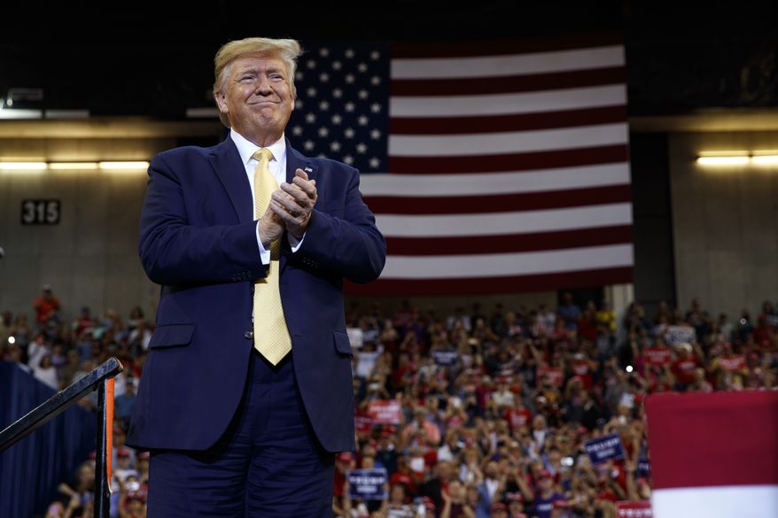 President Donald Trump arrives to speak at a campaign rally at the Lake Charles Civic Center, Friday, Oct. 11, 2019, in Lake Charles, La. (AP Photo/Evan Vucci)