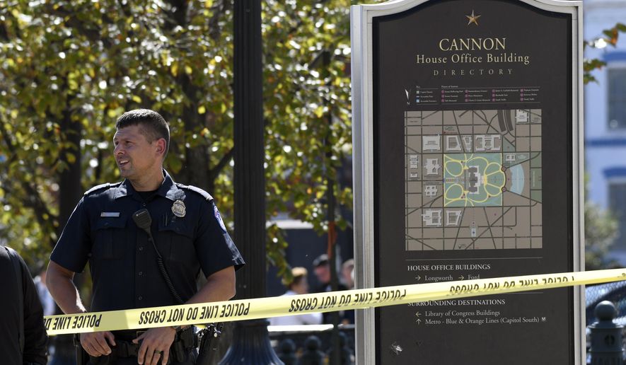 Police gather near the Capitol South Station Metro stop near Capitol Hill in Washington, Friday, Oct. 11, 2019. Police say a boy has been stabbed and seriously injured near the Capitol. The Metropolitan Police Department says officers are looking for a 14-year-old girl in connection with the stabbing. (AP Photo/Susan Walsh)