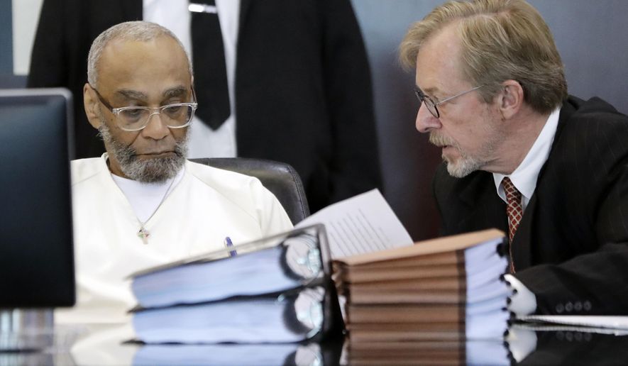 File-This Aug. 28, 2019, file photo shows Abu-Ali Abdur'Rahman, left, signing a court order with the help of his attorney, Brad MacLean, right, during a hearing in Nashville, Tenn. The attorney for a Tennessee death row inmate says the attorney general’s attempt to scuttle a resentencing agreement values “proceduralism over justice.” The comments from MacLean, who has defended Abu-Ali Abudur'Rahman for more than 20 years.The inmate, who is black, was resentenced to life in prison in August after raising claims that racism tainted the jury selection process.(AP Photo/Mark Humphrey, File)