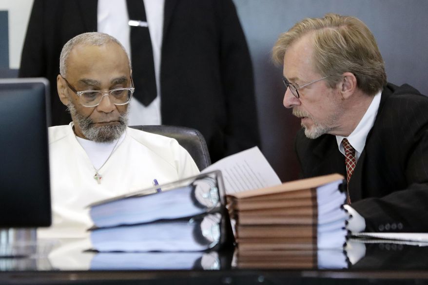 File-This Aug. 28, 2019, file photo shows Abu-Ali Abdur'Rahman, left, signing a court order with the help of his attorney, Brad MacLean, right, during a hearing in Nashville, Tenn. The attorney for a Tennessee death row inmate says the attorney general’s attempt to scuttle a resentencing agreement values “proceduralism over justice.” The comments from MacLean, who has defended Abu-Ali Abudur'Rahman for more than 20 years.The inmate, who is black, was resentenced to life in prison in August after raising claims that racism tainted the jury selection process.(AP Photo/Mark Humphrey, File)