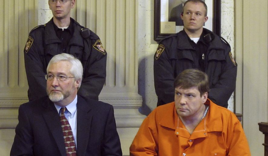 FILE - In this Jan. 25, 2012 file photo, Ken Richey, lower right, sits with attorney Greg Meyers during a court appearance in Ottawa, Ohio. Richey, a Scotsman who was released after two decades on Ohio's death row, has again been charged with threatening a former assistant prosecutor. The Lima News reports Richey pleaded not guilty to retaliation charges Thursday, Oct. 10, 2019. (AP Photo/John Seewer, File)