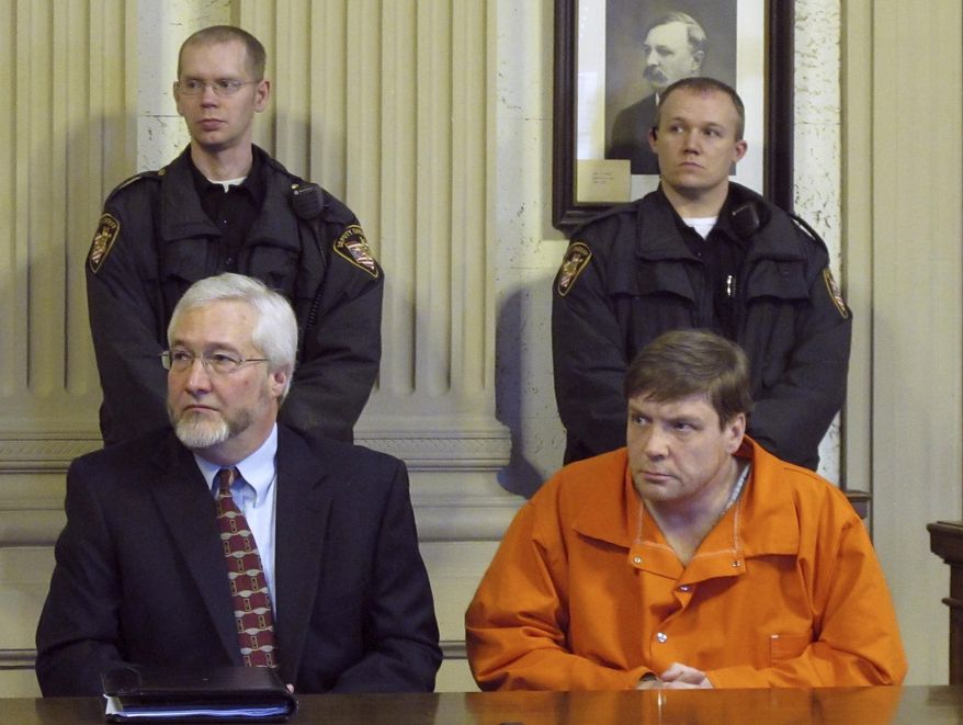 FILE - In this Jan. 25, 2012 file photo, Ken Richey, lower right, sits with attorney Greg Meyers during a court appearance in Ottawa, Ohio. Richey, a Scotsman who was released after two decades on Ohio's death row, has again been charged with threatening a former assistant prosecutor. The Lima News reports Richey pleaded not guilty to retaliation charges Thursday, Oct. 10, 2019. (AP Photo/John Seewer, File)