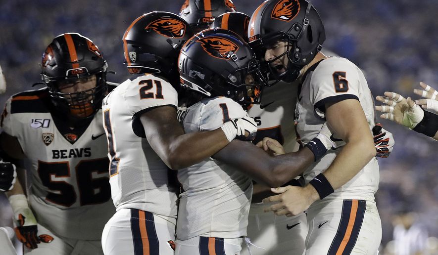 Oregon State wide receiver Tyjon Lindsey (1) celebrates his touchdown catch with teammates during the second half of an NCAA college football game against UCLA on Saturday, Oct. 5, 2019, in Pasadena, Calif. (AP Photo/Marcio Jose Sanchez)
