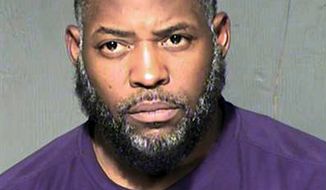 FILE - This undated file photo provided by the Maricopa County Sheriff&#39;s Department shows Abdul Malik Abdul Kareem, a Phoenix man who was convicted of providing guns to two friends who launched a 2015 attack on a Prophet Muhammad cartoon contest in suburban Dallas. The judge in Kareem&#39;s case will hold a hearing Tuesday, Oct. 15, 2019, to examine the FBI&#39;s failure to turn over surveillance footage taken outside the attackers&#39; Phoenix apartment until three years after Kareem was convicted. (Maricopa County Sheriff&#39;s Department via AP, File)