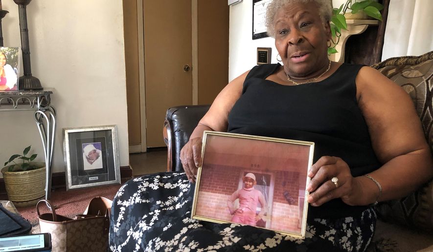 Minnie Hill holds a photo of her late daughter, Rosie Hill, as she speaks to a reporter in her home on Thursday, Oct. 10, 2019 in Memphis, Tenn. Rosie Hill was found dead in Florida in 1982. In 2018, after Texas authorities began tying Samuel Little to murders around the country, Marion County, Fla., Sheriff’s Detective Sgt. Michael Mongeluzzo joined police from several states who flew to a Texas prison, where Little was temporarily being held, in efforts to bring closure for their cold cases. The sheriff’s office said “Little confessed to killing Rosie Hill and dumping her body,” and even “told Sgt. Mongeluzzo that he killed Rosie because God put him on this earth to do it.” (AP Photo/Adrian Sainz)