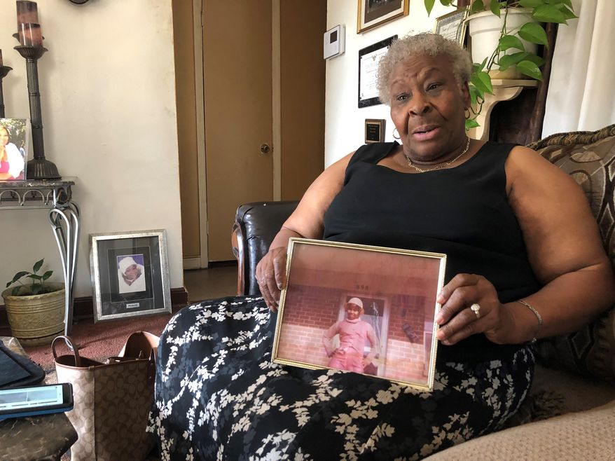 Minnie Hill holds a photo of her late daughter, Rosie Hill, as she speaks to a reporter in her home on Thursday, Oct. 10, 2019 in Memphis, Tenn. Rosie Hill was found dead in Florida in 1982. In 2018, after Texas authorities began tying Samuel Little to murders around the country, Marion County, Fla., Sheriff’s Detective Sgt. Michael Mongeluzzo joined police from several states who flew to a Texas prison, where Little was temporarily being held, in efforts to bring closure for their cold cases. The sheriff’s office said “Little confessed to killing Rosie Hill and dumping her body,” and even “told Sgt. Mongeluzzo that he killed Rosie because God put him on this earth to do it.” (AP Photo/Adrian Sainz)