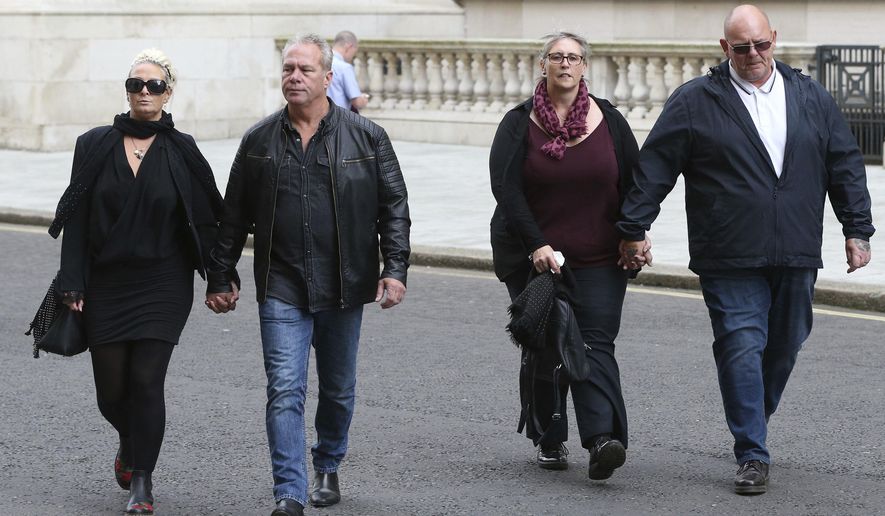 The family Harry Dunn, mother Charlotte Charles, left, and father Tim Dunn, right, arrive with their partners at the Foreign and Commonwealth Office in London, where they are meeting British Foreign Secretary Dominic Raab, Wednesday Oct. 9, 2019. 19-year old Harry Dunn was killed in a road accident Aug. 27, involving an American diplomat's wife who left the country under Diplomatic Immunity after reportedly becoming a suspect in the fatal crash. (Jonathan Brady/PA via AP)