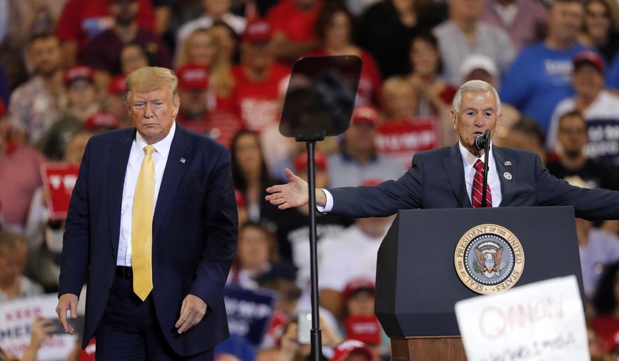 Louisiana Republican gubernatorial candidate Eddie Rispone, right, speaks at President Donald Trump&#39;s campaign rally in Lake Charles, La., Friday, Oct. 11, 2019. Mr. Rispone placed second in the Oct. 12 gubernatorial primary and will face off in November against incumbent Democratic Gov. John Bel Edwards. (AP Photo/Gerald Herbert) **FILE**
