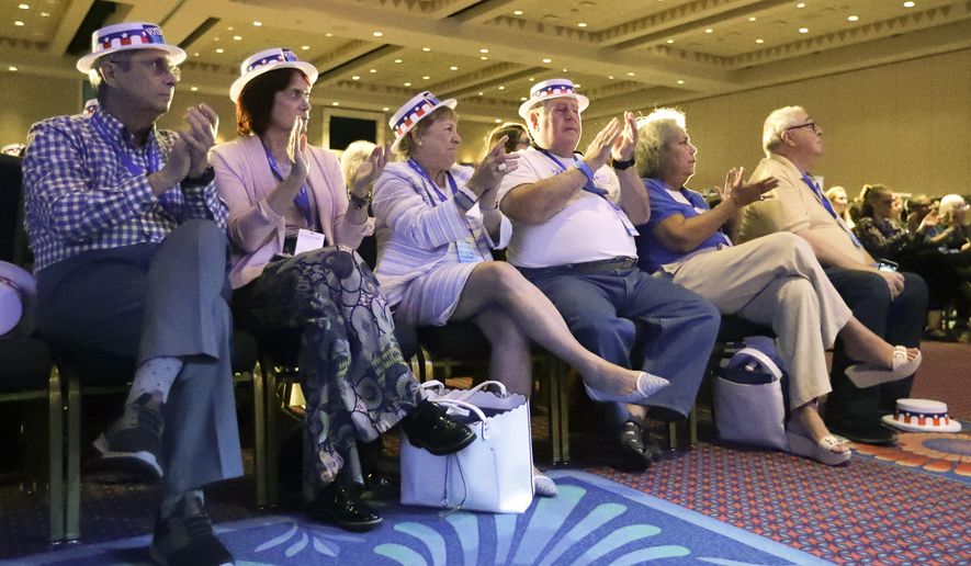 Attendees applaud as they listen to speakers during the Florida Democratic State Convention Saturday, Oct. 12, 2019, in Lake Buena Vista, Fla. (AP Photo/John Raoux)