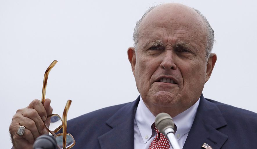 In this Aug. 1, 2018, file photo, Rudy Giuliani, an attorney for President Donald Trump, speaks in Portsmouth, N.H. President Donald Trump on Saturday, Oct. 12, 2019, stood behind personal attorney Giuliani, one of his highest-profile and most vocal defenders, amid reports that federal prosecutors in the city Giuliani led as mayor are eyeing him for possible lobbying violations. (AP Photo/Charles Krupa, File) **FILE**