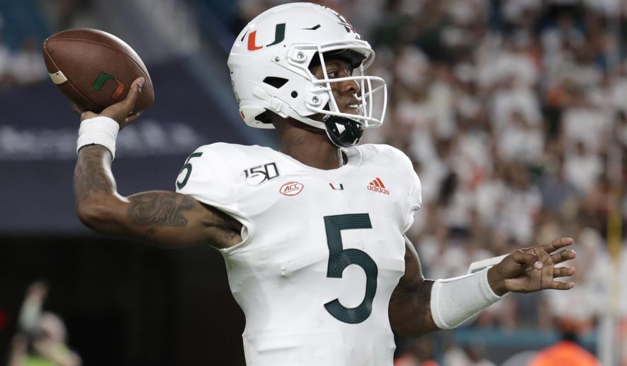 Miami quarterback N'Kosi Perry (5) throws a pass during the second half of the team's NCAA college football game against Virginia, Friday, Oct. 11, 2019, in Miami Gardens, Fla. Miami won 17-9. (AP Photo/Lynne Sladky)