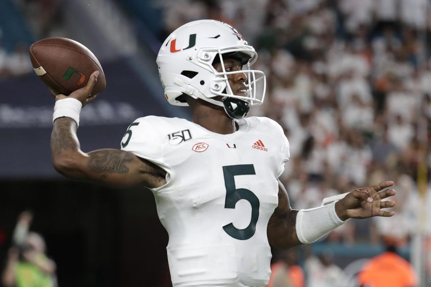 Miami quarterback N'Kosi Perry (5) throws a pass during the second half of the team's NCAA college football game against Virginia, Friday, Oct. 11, 2019, in Miami Gardens, Fla. Miami won 17-9. (AP Photo/Lynne Sladky)
