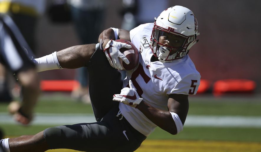 Washington State wide receiver Travell Harris makes a touchdown catch against Arizona State during the first half of an NCAA college football game Saturday, Oct. 12, 2019, in Tempe, Ariz. (AP Photo/Ross D. Franklin)